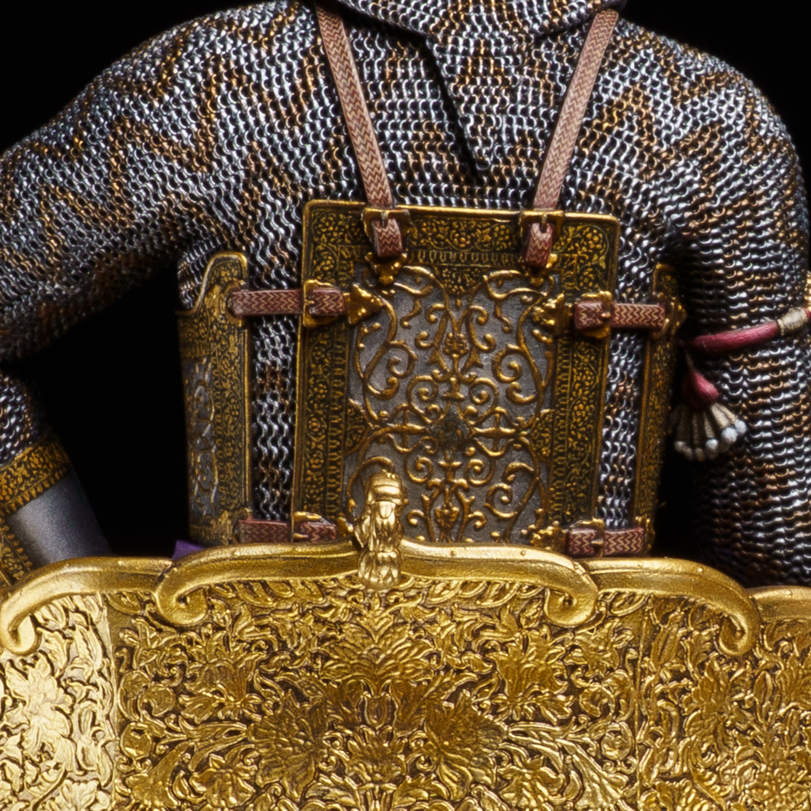The rear view shows how the cuirass sits over the mail and wraps around the torso.